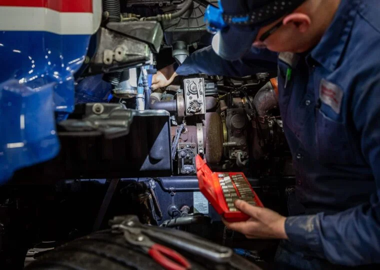 Technician working on engine
